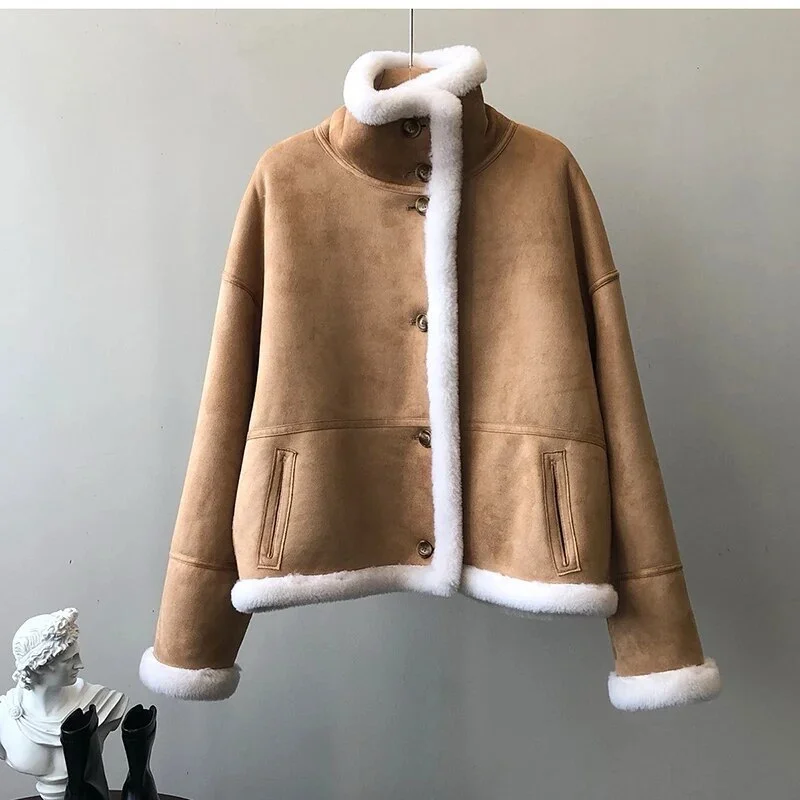 Winter luxury: faux leather shearling coat lined with real sheepskin. Double sided. for maximum warmth and style. Handmade